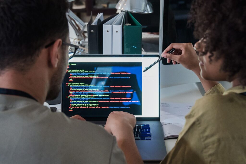 Team collaborating on computers annotating data for AI