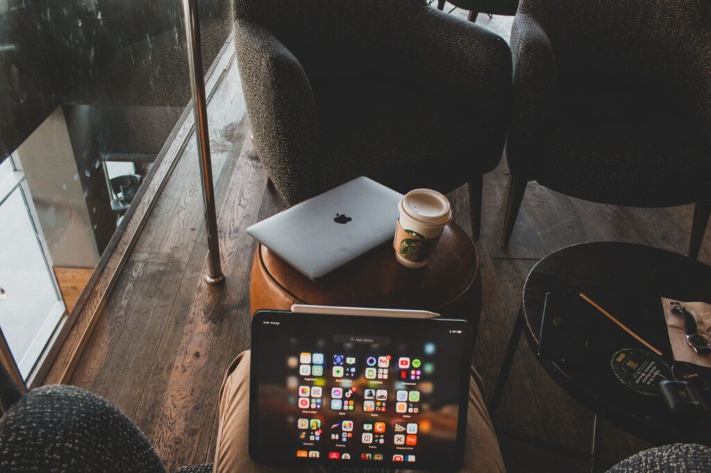 Laptop screen showing AI tools and apps on a desk